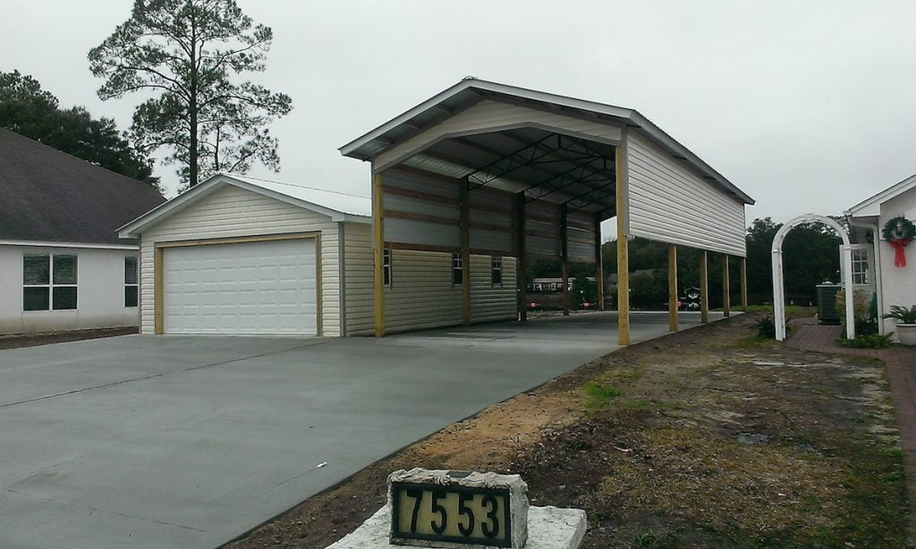 LARGE RV COVER GARAGE AND CONCRETE DRIVEWAY