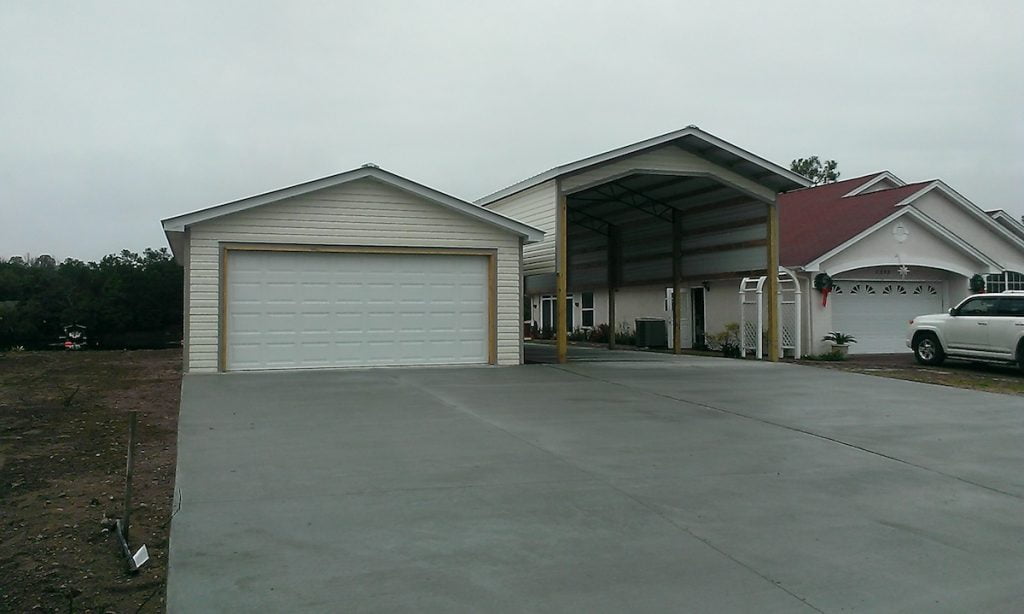 2 CAR GARAGE RV COVER AND LARGE CONCRETE DRIVEWAY