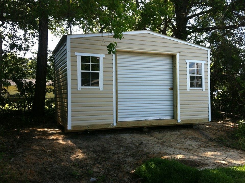 12X16 PORTABLE WITH ROLL UP DOOR