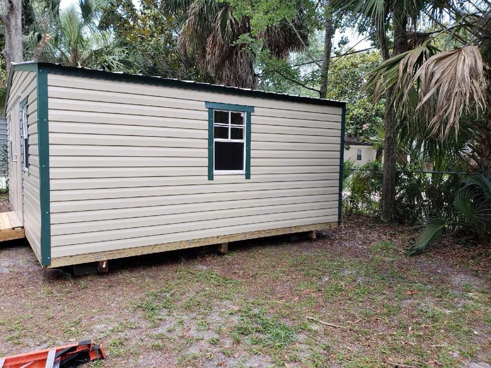 16X20 PORTABLE BUILDING TAN WITH GREEN TRIM