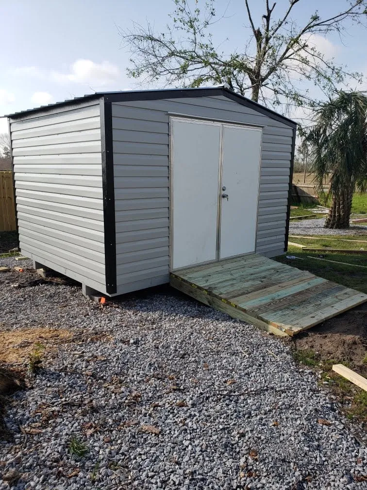 10X12 PORTABLE WITH A 6 FOOT DOOR