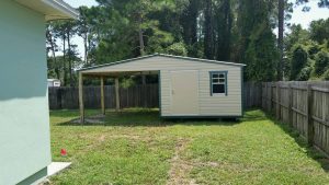 12X20 WITH 12X20 CARPORT TAN WITH GREEN TRIM