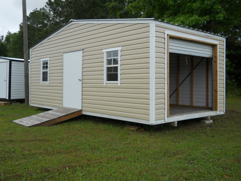 12X24 PORTABLE BUILDING WITH ROLL UP DOOR TAN AND WHITE