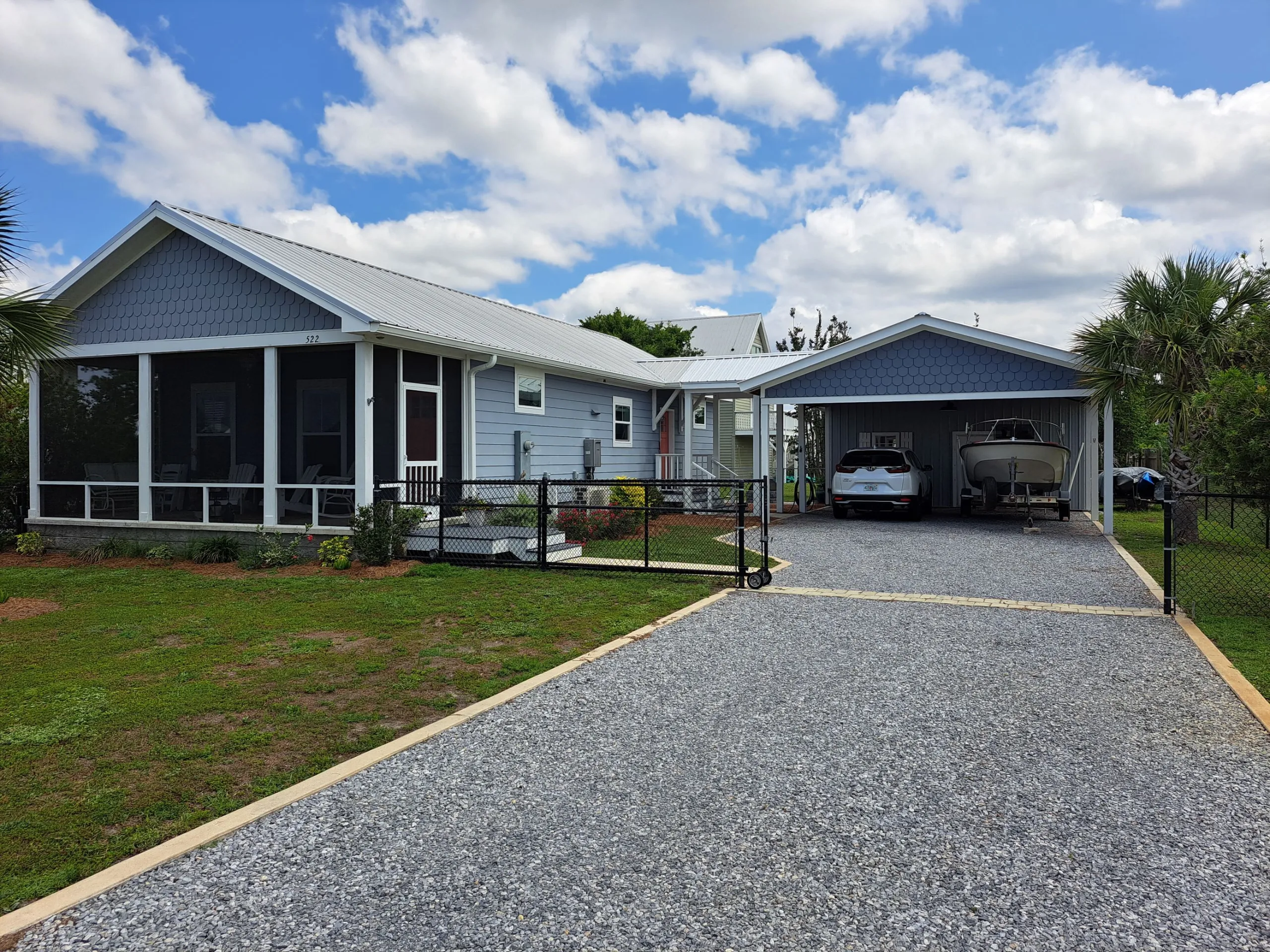 BEACH COTTAGE WITH GRAVEL DRIVE AND CARPORT GARAGE COMBO