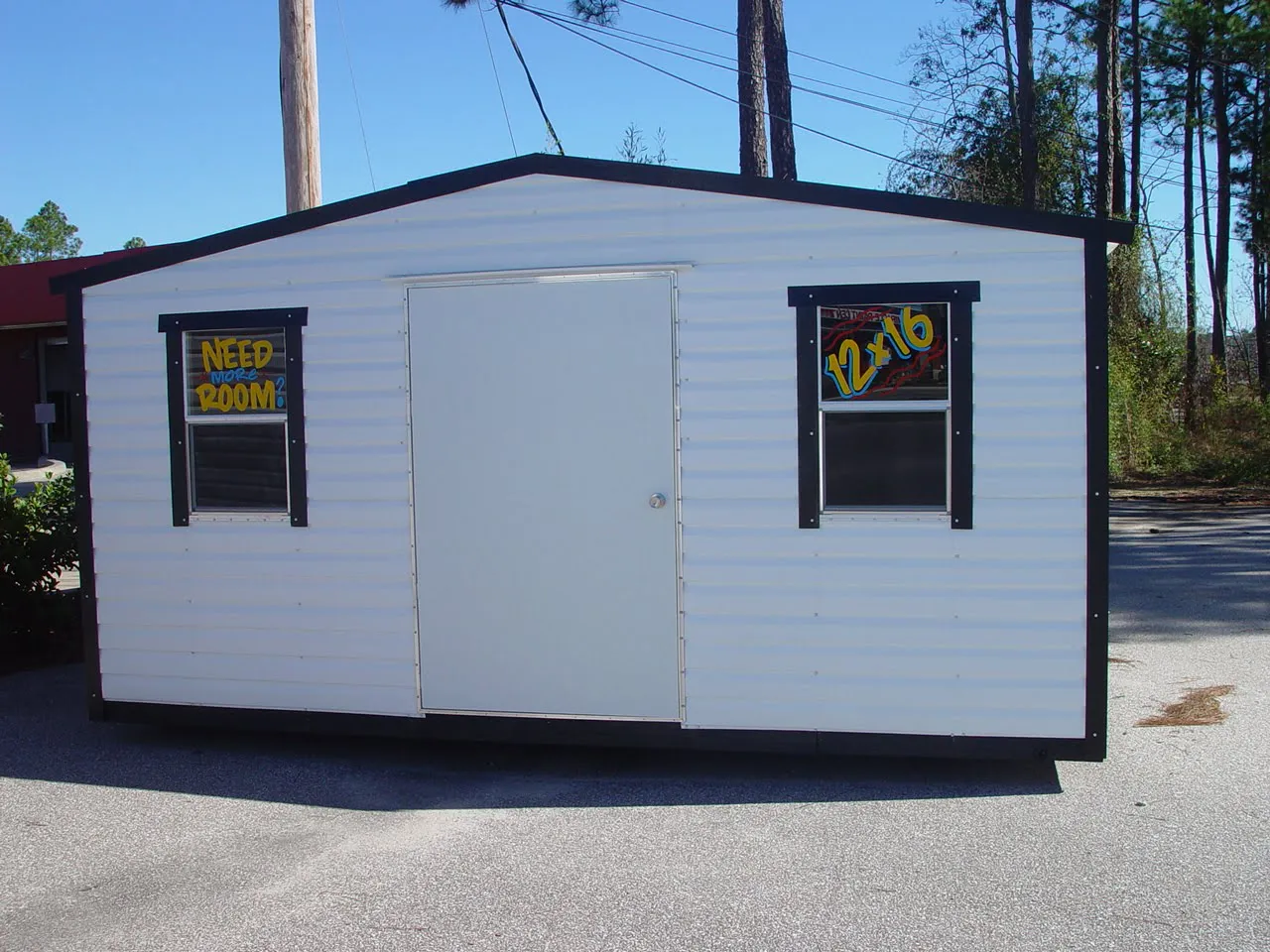 12X16 PORTABLE BUILDING WHITE WITH BLACK TRIM