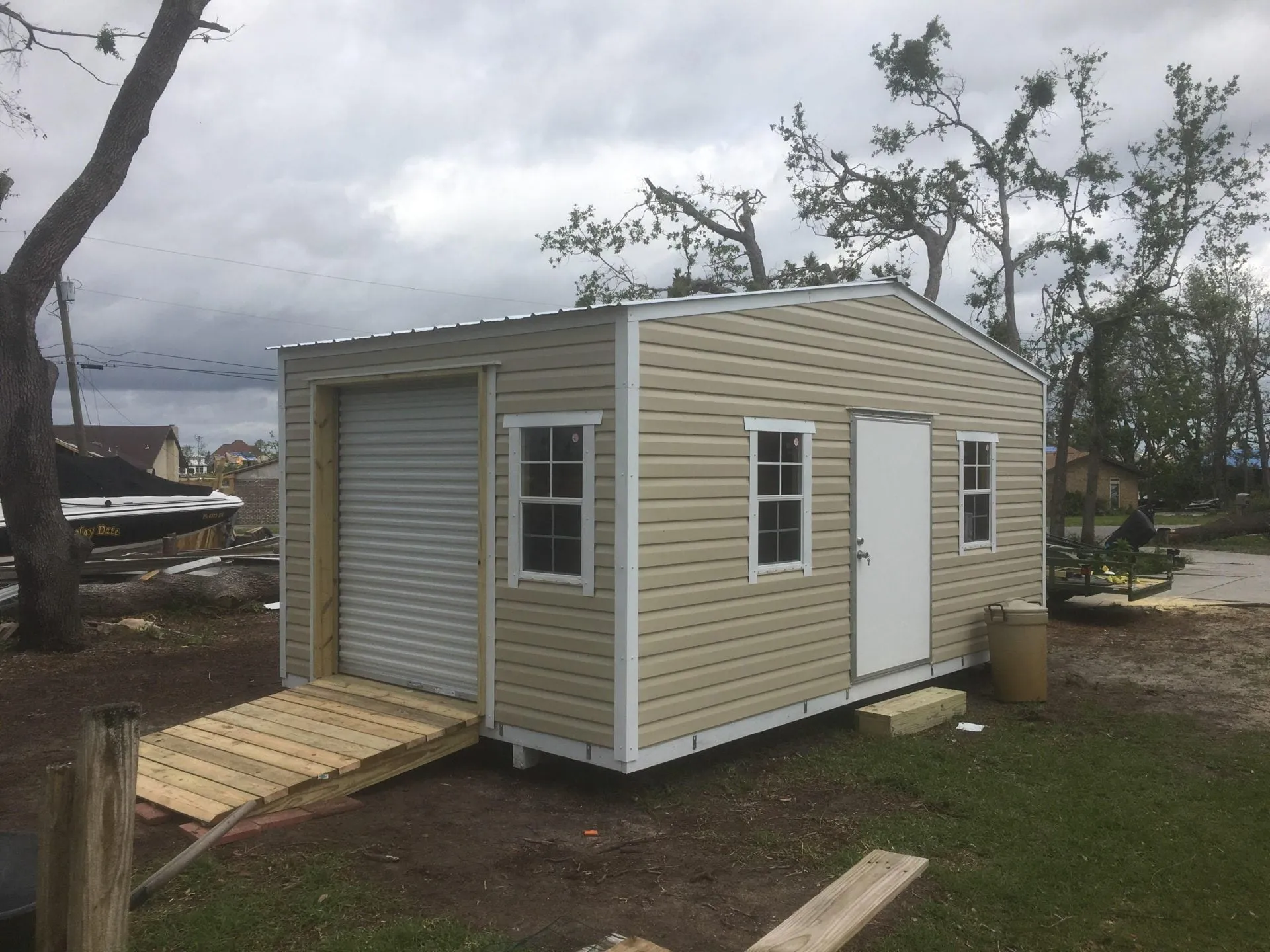12X20 PORTABLE WITH ROLL UP DOOR AND RAMP