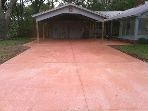CAPPORT WITH RED CONCRETE DRIVE