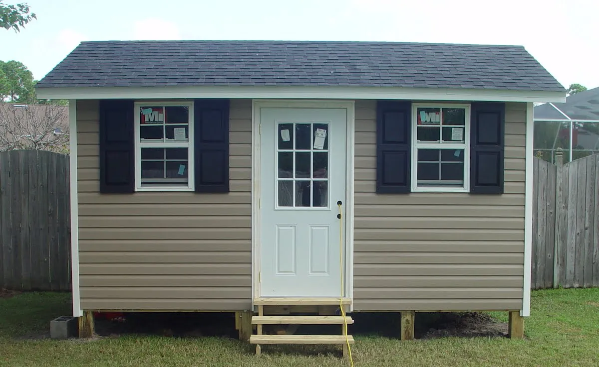 8X12 VINYL WITH SHINGLE ROOF TO MATCH HOUSE